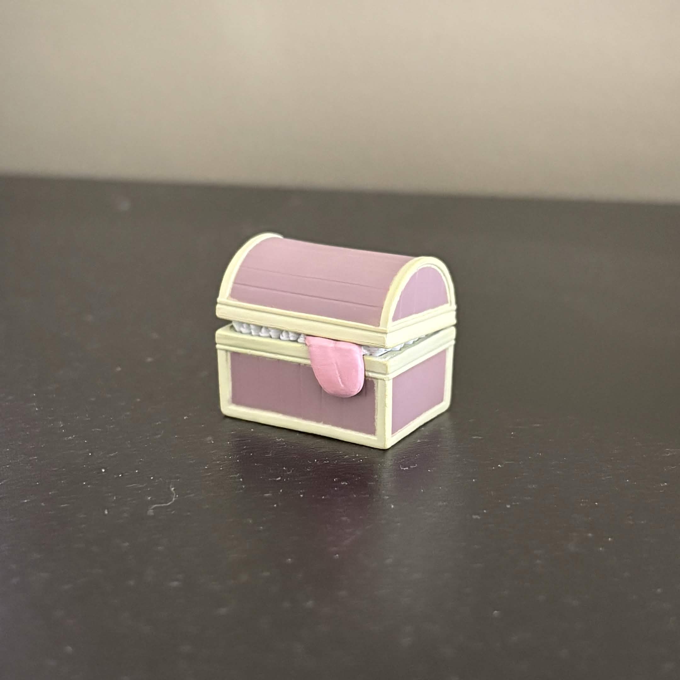 If you watch anime the 'Frieren: Beyond Journey's End', you might found this little creature familiar. The mimic chest. Feel free to touch it, you just got devour and now you have messy hair.